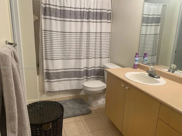 a bathroom with a sink a toilet and tub