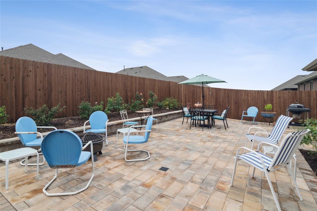 113 Lantern Road Caddo Mills, TX 75135 - Photo 1 of 25 a view of a dinning table and chairs in the patio