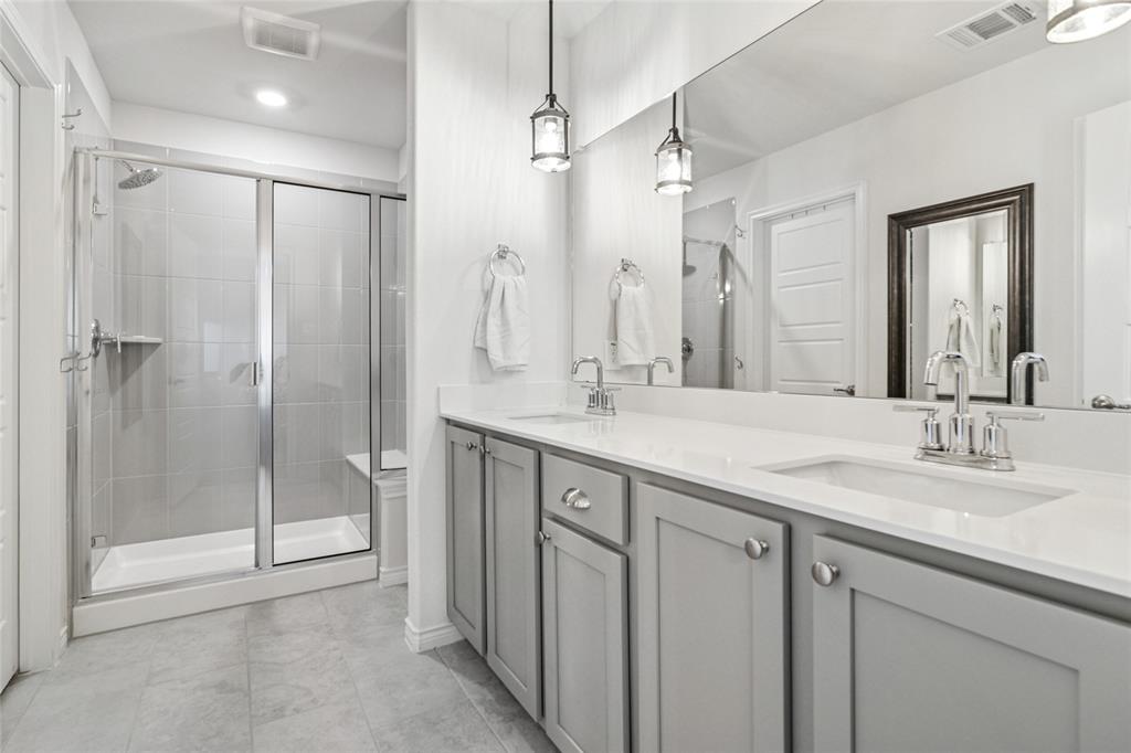 113 Lantern Road Caddo Mills, TX 75135 - Photo 14 of 25 a bathroom with a double vanity sink mirror and shower