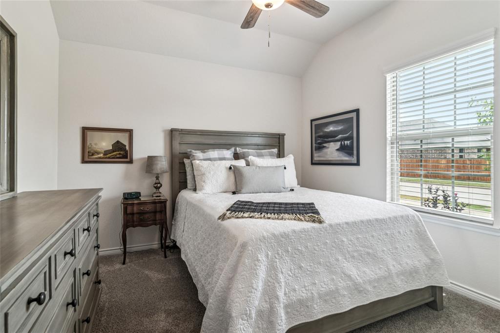 113 Lantern Road Caddo Mills, TX 75135 - Photo 9 of 25 a bedroom with a bed and a window