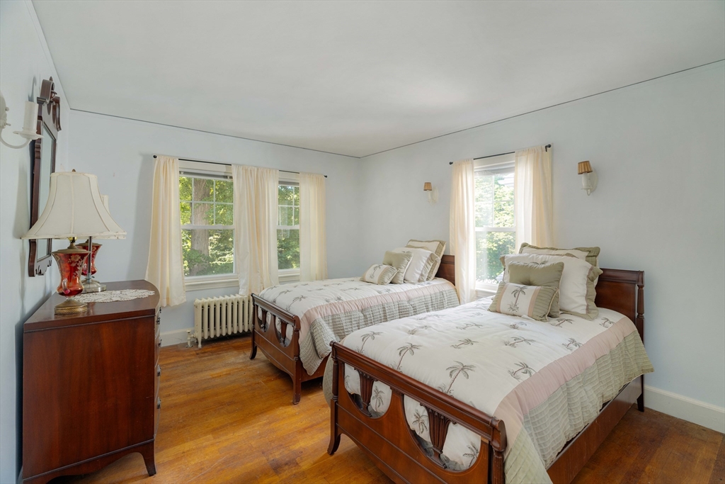45 Pershing Road Boston, MA 02130 - Photo 15 of 29 a bedroom with two beds and a window