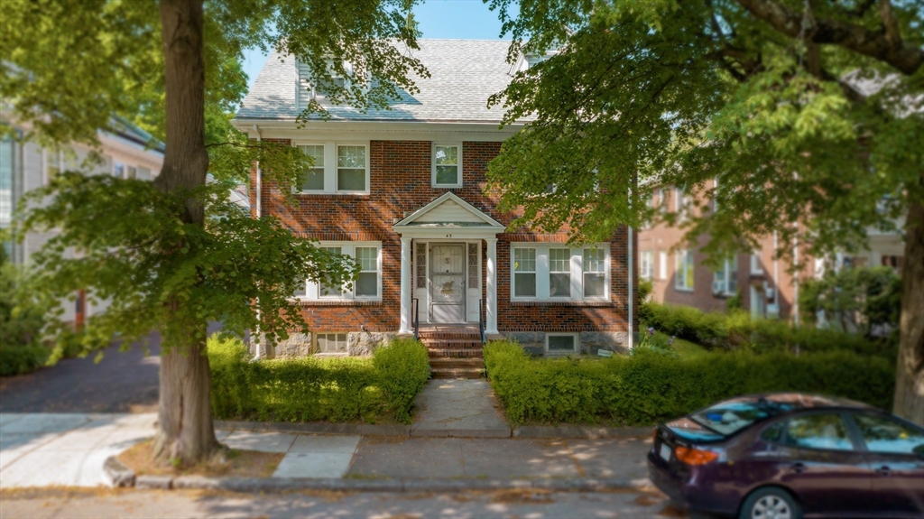 45 Pershing Road Boston, MA 02130 - Photo 16 of 29 a front view of a house with garden