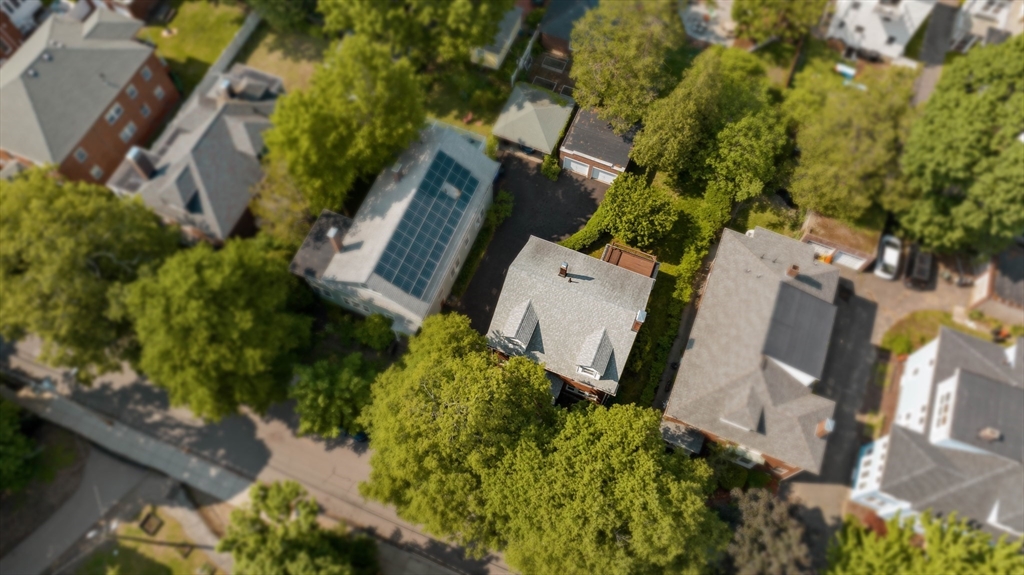 45 Pershing Road Boston, MA 02130 - Photo 17 of 29 an aerial view of a house with outdoor space and a lake view