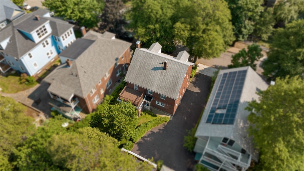 45 Pershing Road Boston, MA 02130 - Photo 20 of 29 an aerial view of a house with outdoor space and a lake view