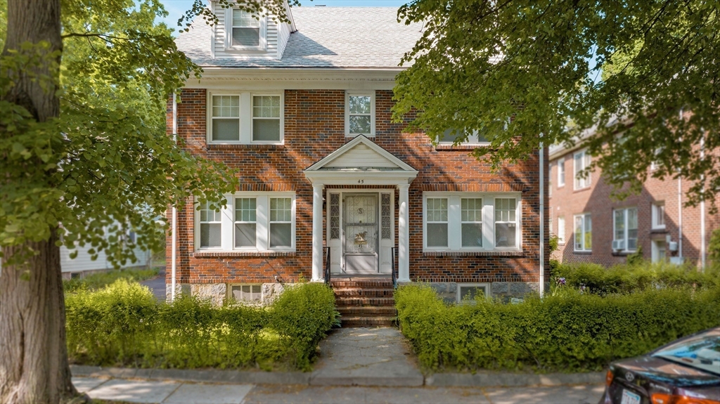 45 Pershing Road Boston, MA 02130 - Photo 29 of 29 a front view of a house with garden