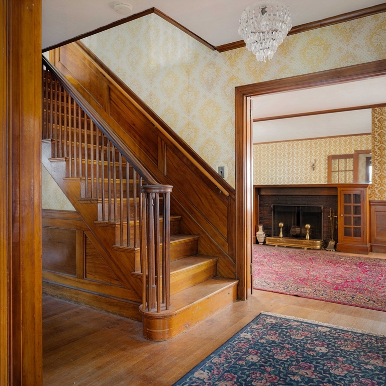 45 Pershing Road Boston, MA 02130 - Photo 4 of 29 a view of entryway and hall with wooden floor
