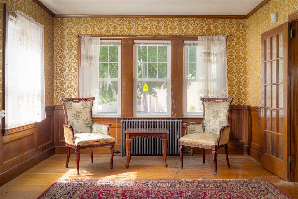 45 Pershing Road Boston, MA 02130 - Photo 10 of 29 a living room with furniture and a window