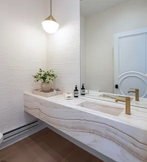 a bathroom with a sink and a mirror