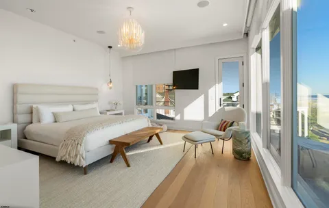 a bathroom with a sink toilet and window