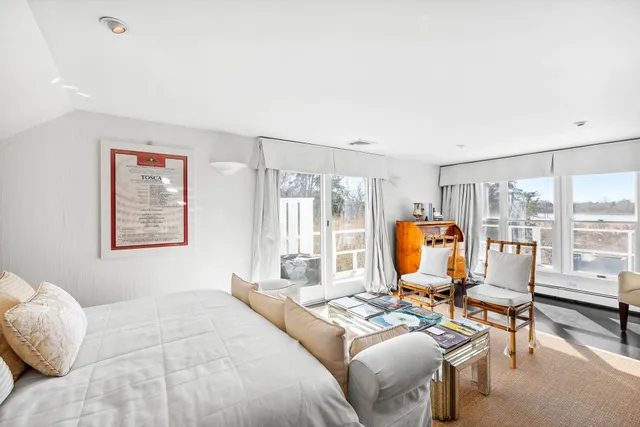 a living room with furniture or couch and a large window