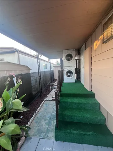 a view of a car park in front of a house