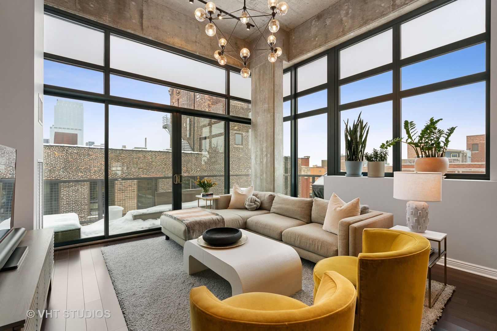 321 South Sangamon Street, Unit 906 Chicago, IL 60607 - Photo 2 of 11 a living room with furniture and a large window