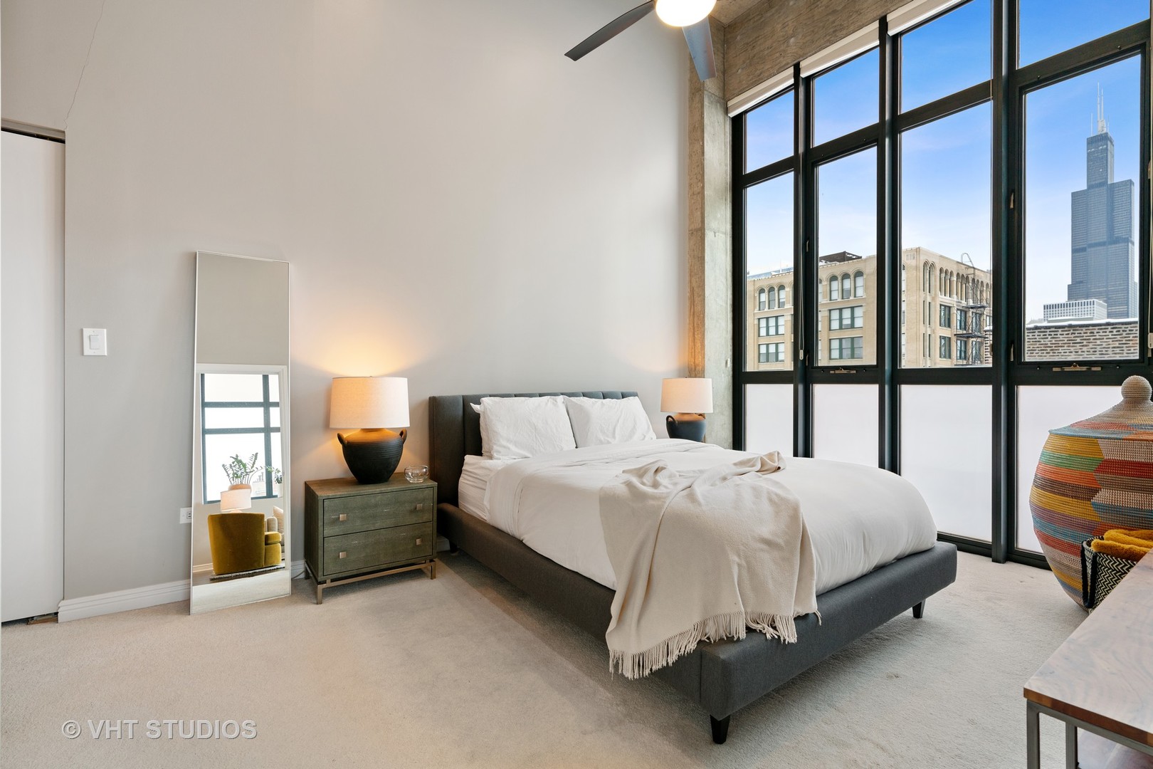 321 South Sangamon Street, Unit 906 Chicago, IL 60607 - Photo 7 of 11 a bed sitting in a bedroom next to a window