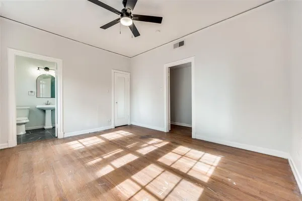 a view of an empty room with a bathroom