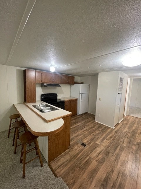 7 Thomas Circle Hickman, TN 38567 - Photo 5 of 10 a kitchen with kitchen island a stove and a refrigerator