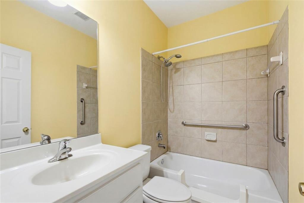 3420 Bulloch Lake Road Loganville, GA 30052 - Photo 13 of 57 a bathroom with a sink toilet and shower