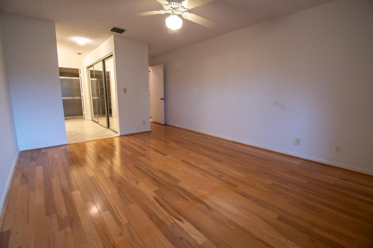 8218 Springtree Road Boca Raton, FL 33496 - Photo 3 of 16 Real hardwood floors in master