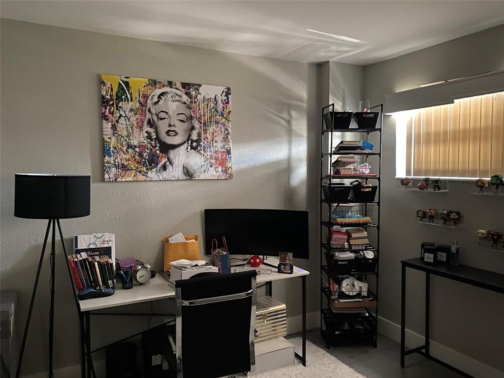 3031 Northeast 51st Street, Unit 305W Fort Lauderdale, FL 33308 - Photo 7 of 11 a view of a workspace with furniture and a window