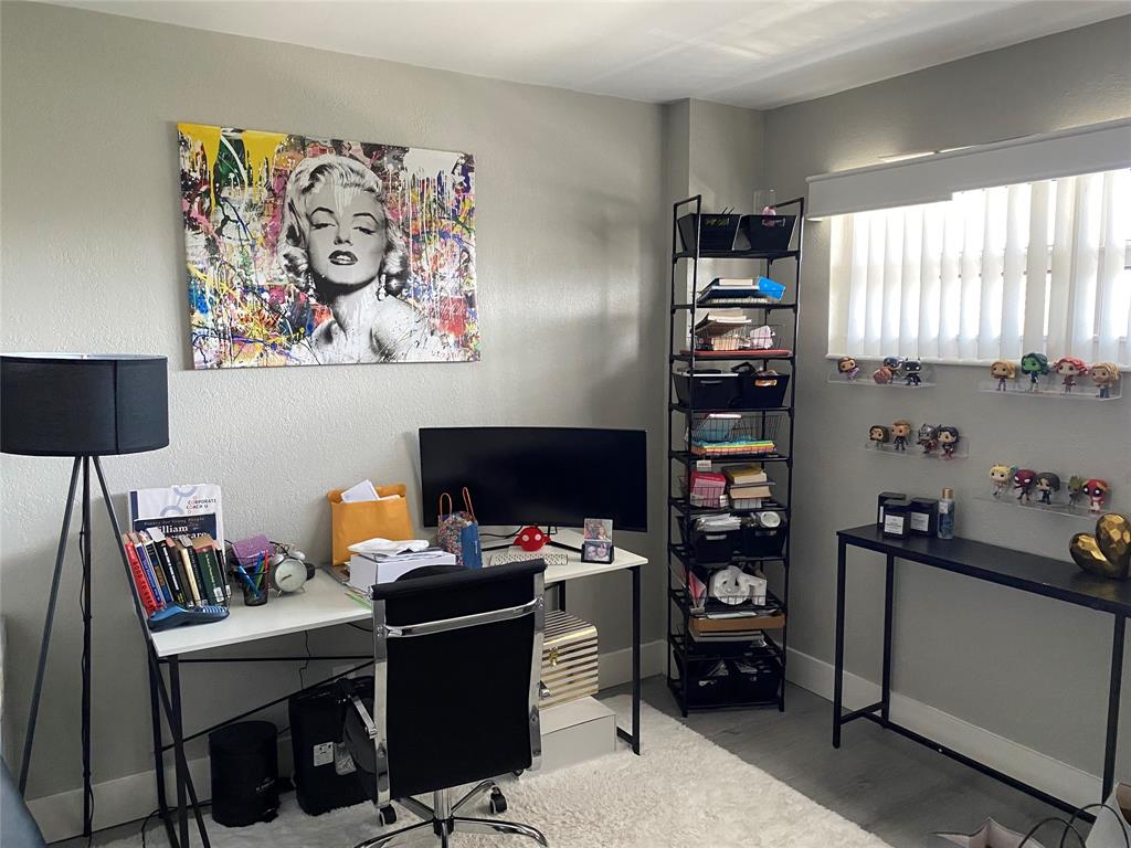 3031 Northeast 51st Street, Unit 305W Fort Lauderdale, FL 33308 - Photo 8 of 11 a view of a workspace with furniture and a window