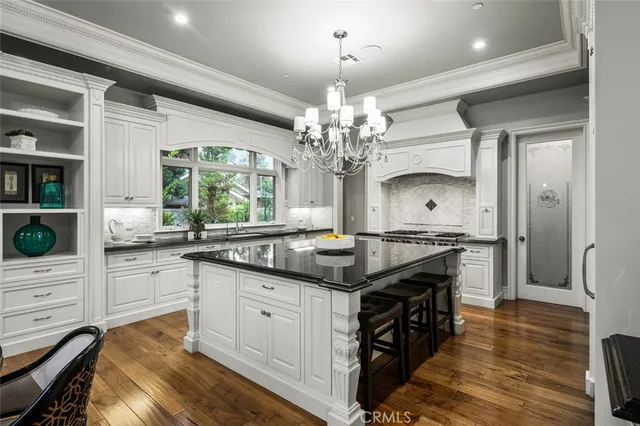 a bathroom with sinks mirror and a bathtub
