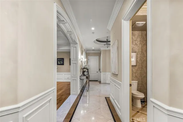 a view of a hallway view with wooden floor and staircase