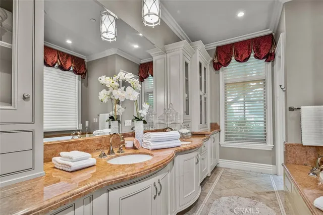 a kitchen with a sink and cabinets