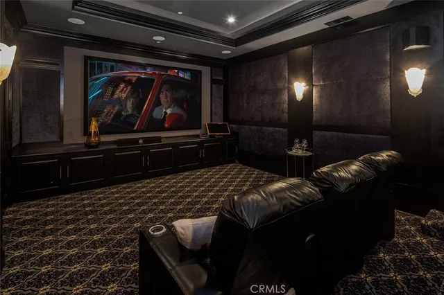 a bathroom with a granite countertop sink a large mirror and a window