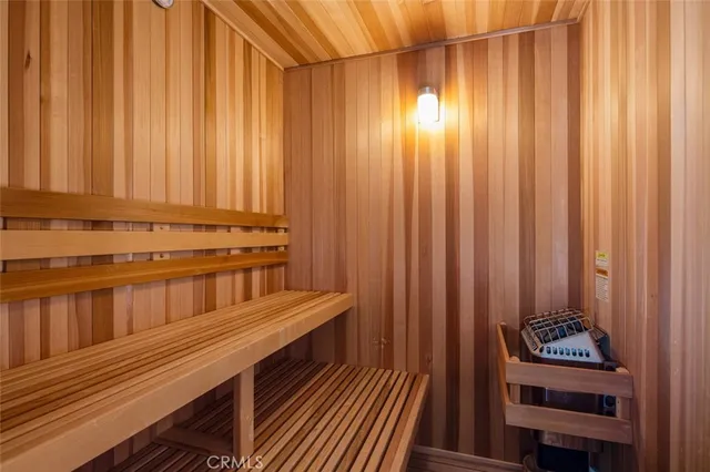 a spacious bedroom with a bed and a couch