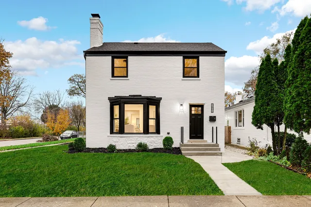 a bedroom with a bed and a lamp on table