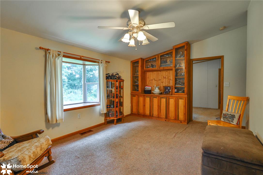 3795 Rhoades Road Kempton, PA 19529 - Photo 28 of 42 A built-in wood cabinet provides ample storage and display space in this inviting living area.