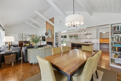a very nice looking dining room with a large window