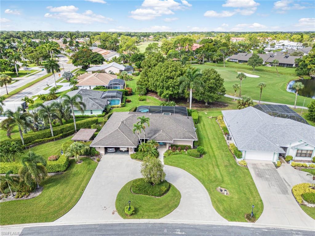 Home entry is enhanced by a large circular driveway allowing for several to visit.