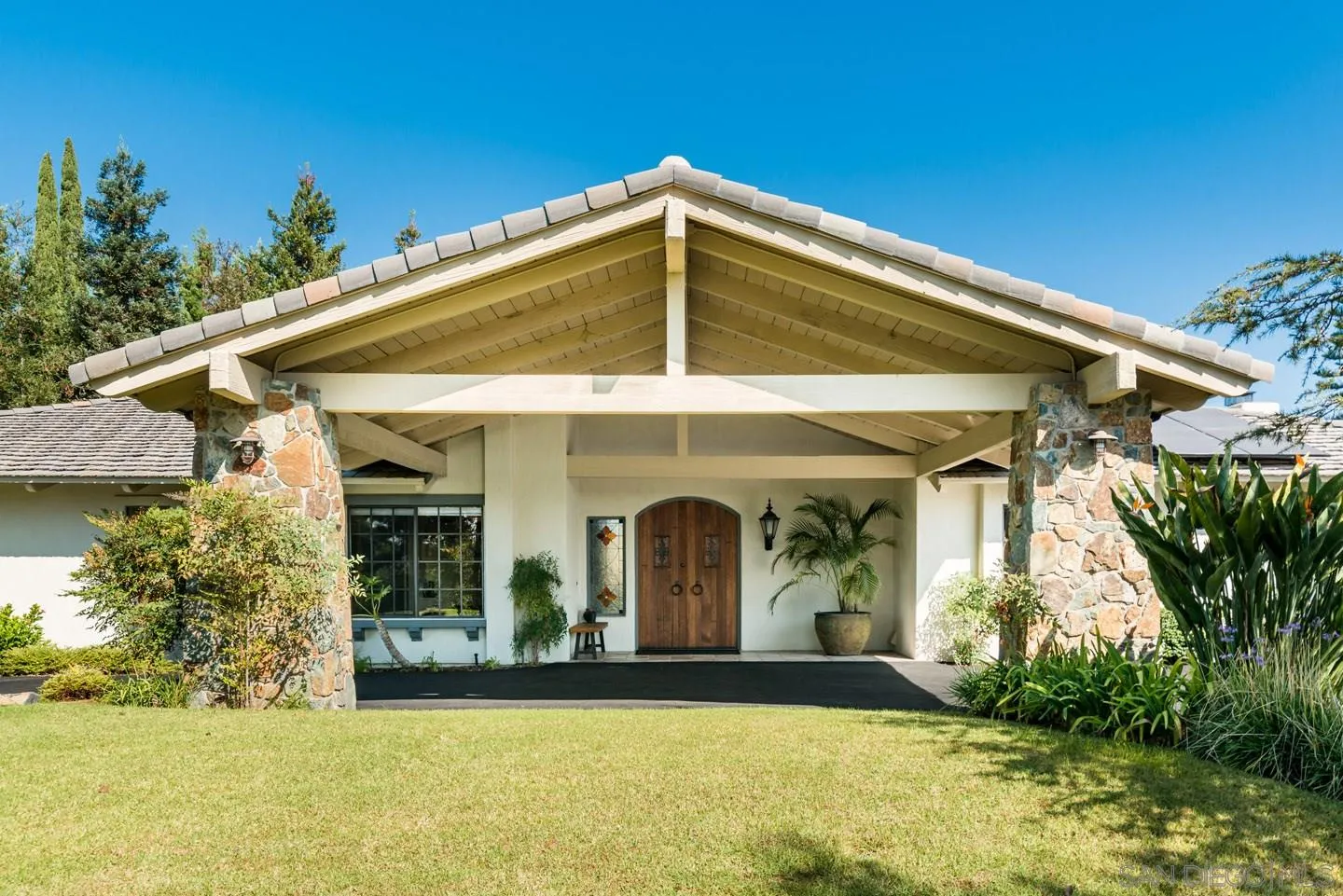 a front view of a house with garden