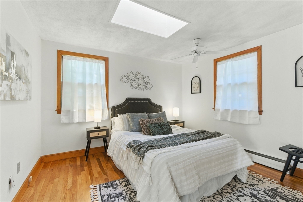 53 Park Street North Reading, MA 01864 - Photo 11 of 24 a bedroom with a bed and a window