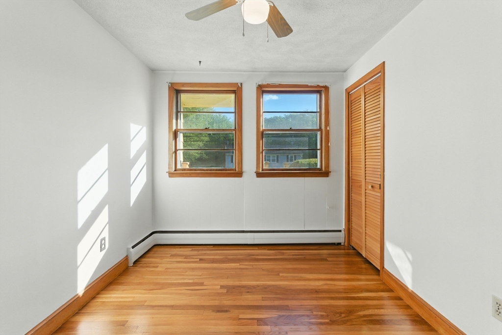 53 Park Street North Reading, MA 01864 - Photo 14 of 24 a view of an empty room with wooden floor and windows