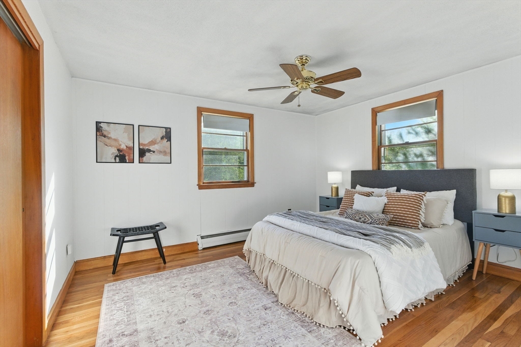 53 Park Street North Reading, MA 01864 - Photo 15 of 24 a bedroom with a bed and a chandelier