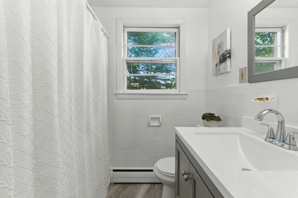 53 Park Street North Reading, MA 01864 - Photo 18 of 24 a bathroom with a sink toilet and window