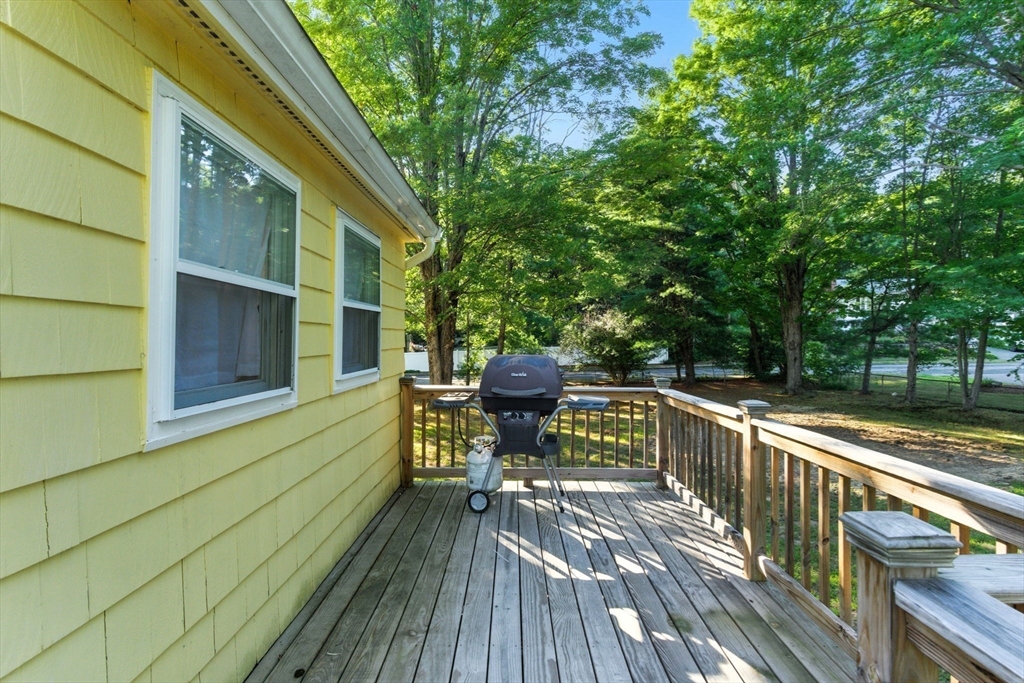 53 Park Street North Reading, MA 01864 - Photo 21 of 24 a view of deck with furniture and trees