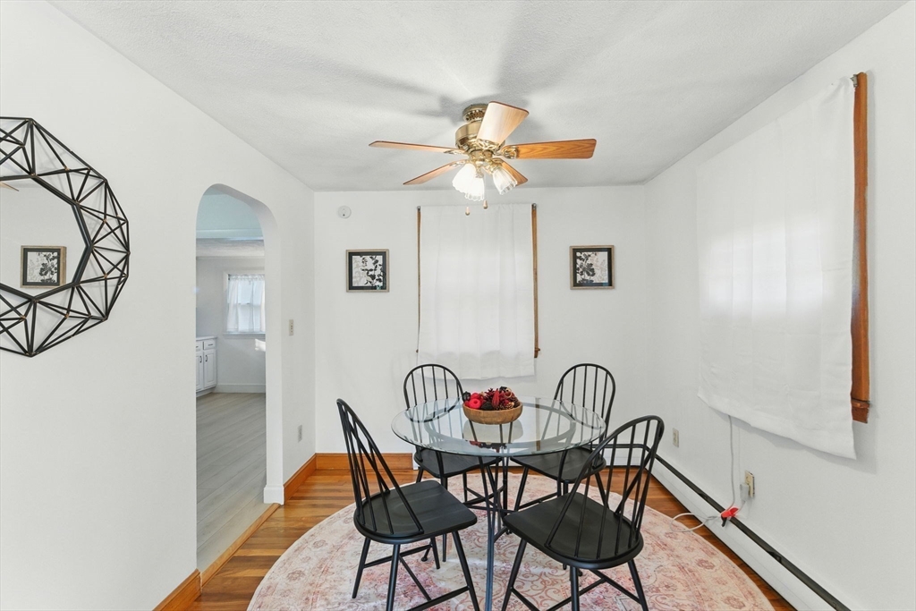53 Park Street North Reading, MA 01864 - Photo 4 of 24 a view of a dining room with furniture and a chandelier