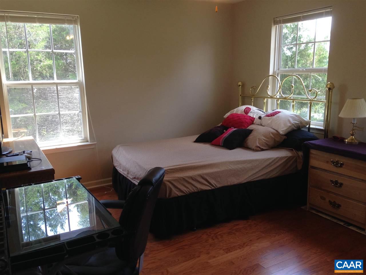 696 Valley View Road Ruckersville, VA 22968 - Photo 12 of 32 a bedroom with a bed closet and a window