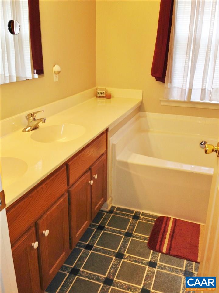 696 Valley View Road Ruckersville, VA 22968 - Photo 14 of 32 a bathroom with a sink and a mirror