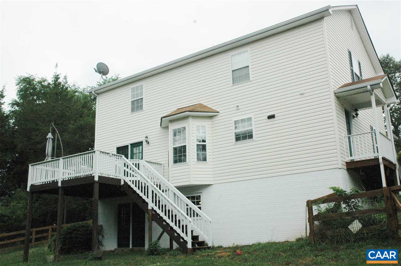 696 Valley View Road Ruckersville, VA 22968 - Photo 23 of 32 a view of a house with backyard and a tree