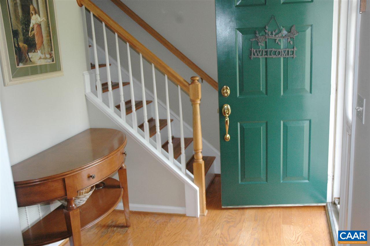 696 Valley View Road Ruckersville, VA 22968 - Photo 3 of 32 a view of staircase with lots of frames on wall and a window