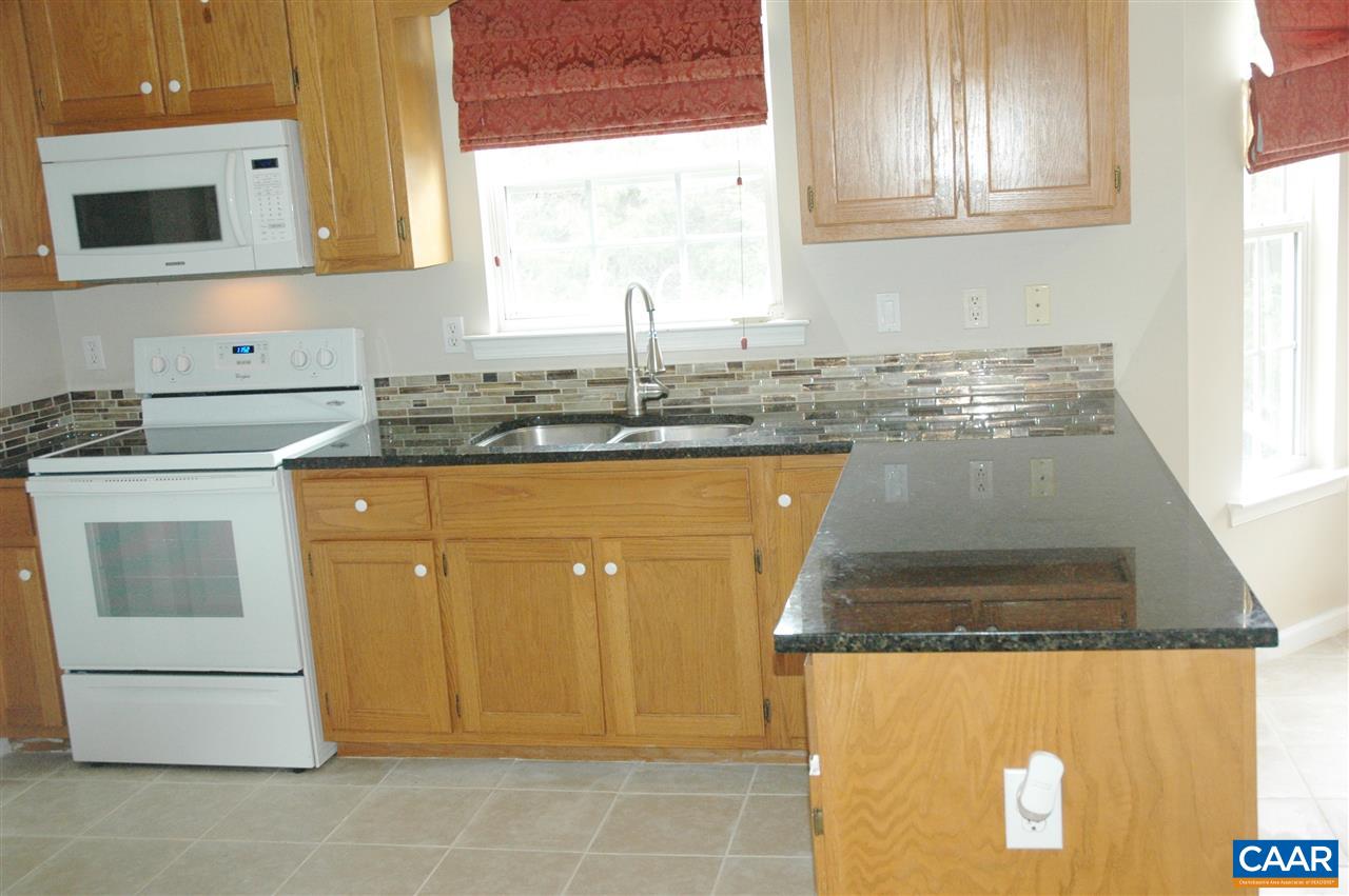 696 Valley View Road Ruckersville, VA 22968 - Photo 5 of 32 a kitchen with a stove a sink and a microwave