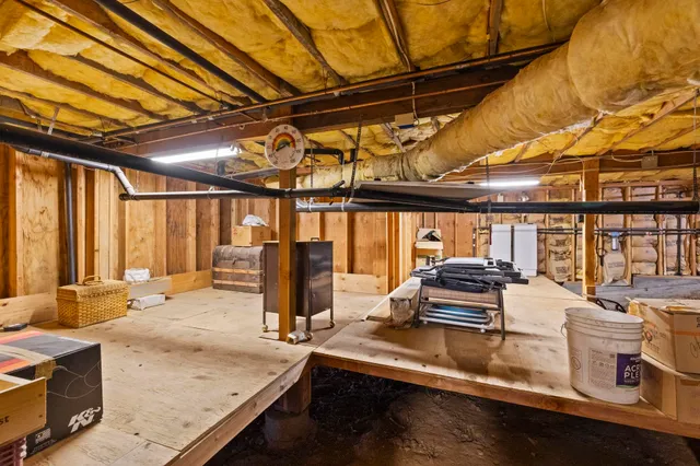 an aerial view of a house with a yard and a garden