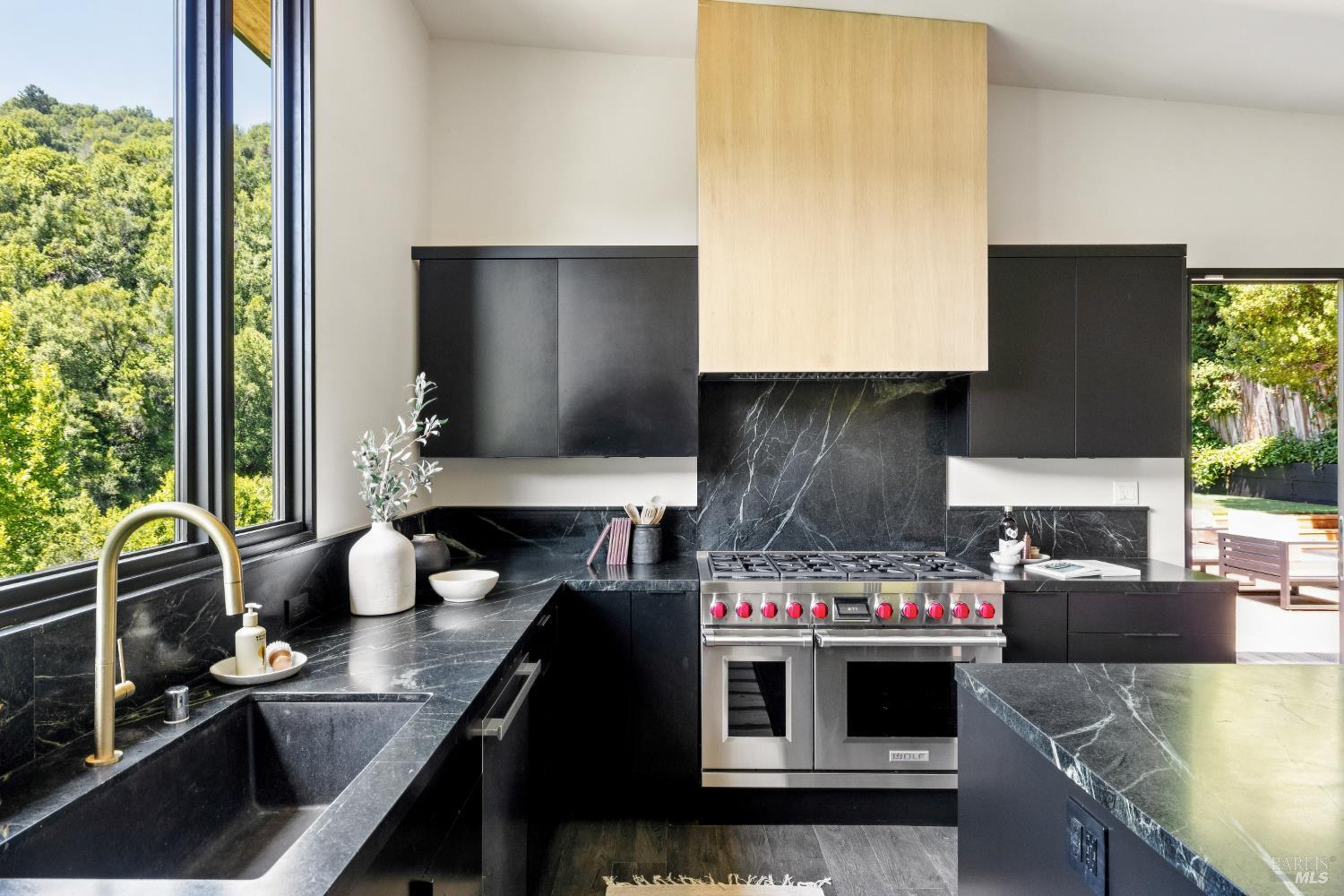 56 Millard Road Larkspur, CA 94939 - Photo 29 of 74 a kitchen with a stove a sink and a microwave