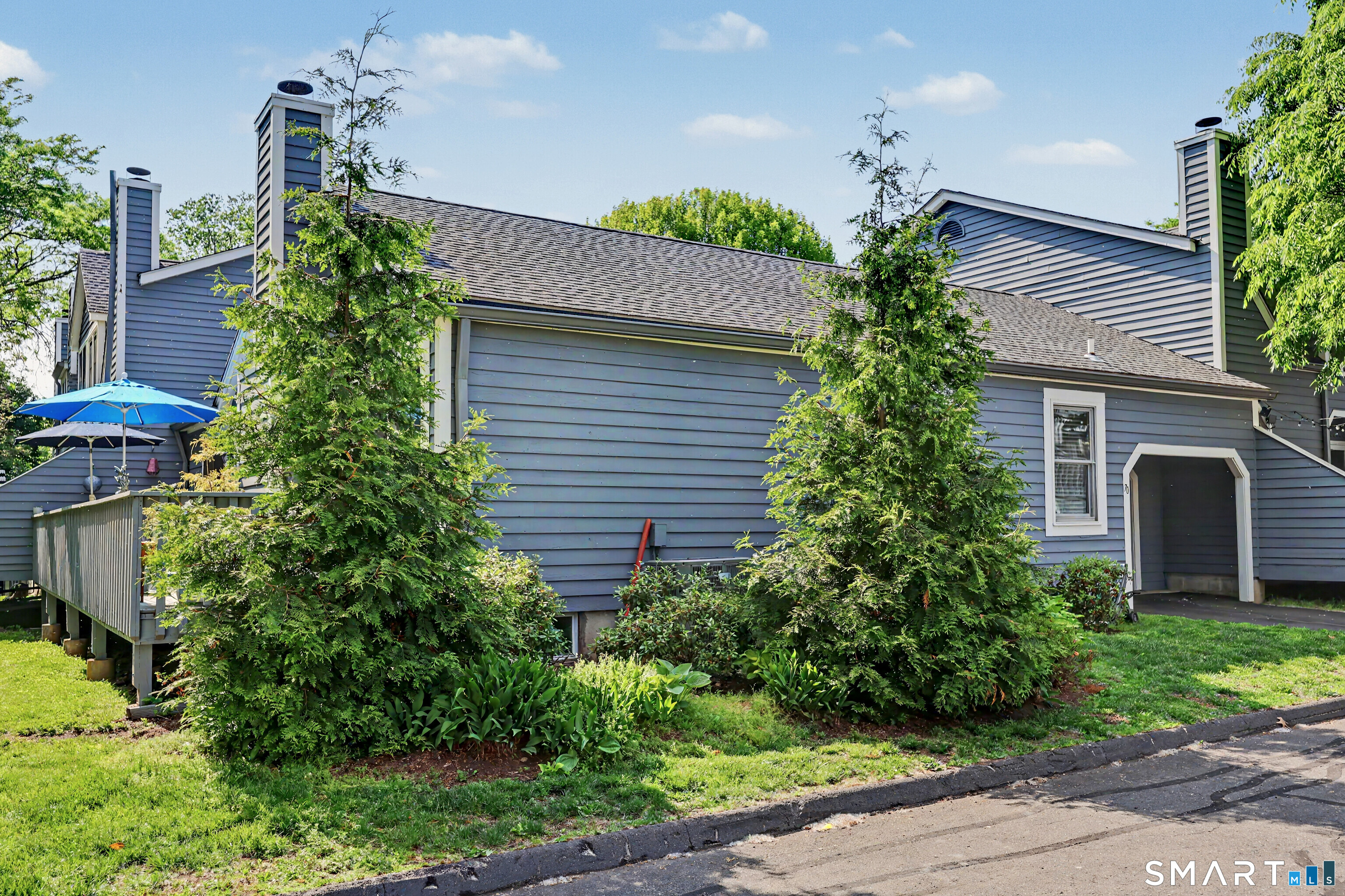 70 Fawn Ridge Lane, Unit 70 Norwalk, CT 06851 - Photo 29 of 36 a plant in front of a house