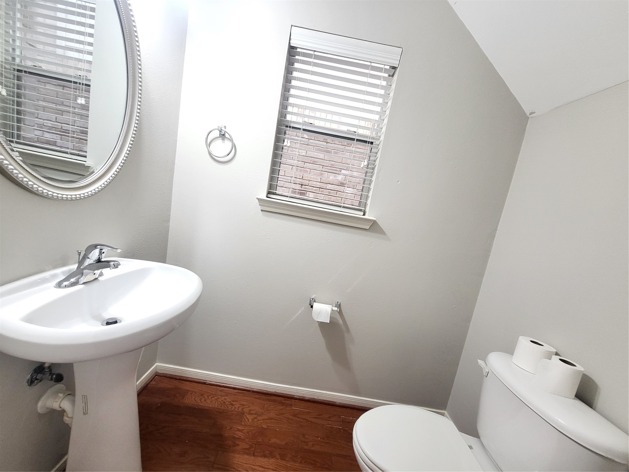 7415 Hollister Ridge Houston, TX 77040 - Photo 15 of 36 a bathroom with a sink a mirror and a toilet