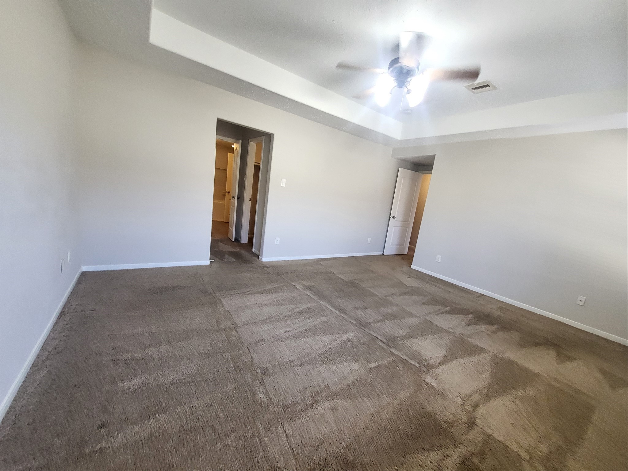 7415 Hollister Ridge Houston, TX 77040 - Photo 21 of 36 a view of a hallway with a chandelier fan