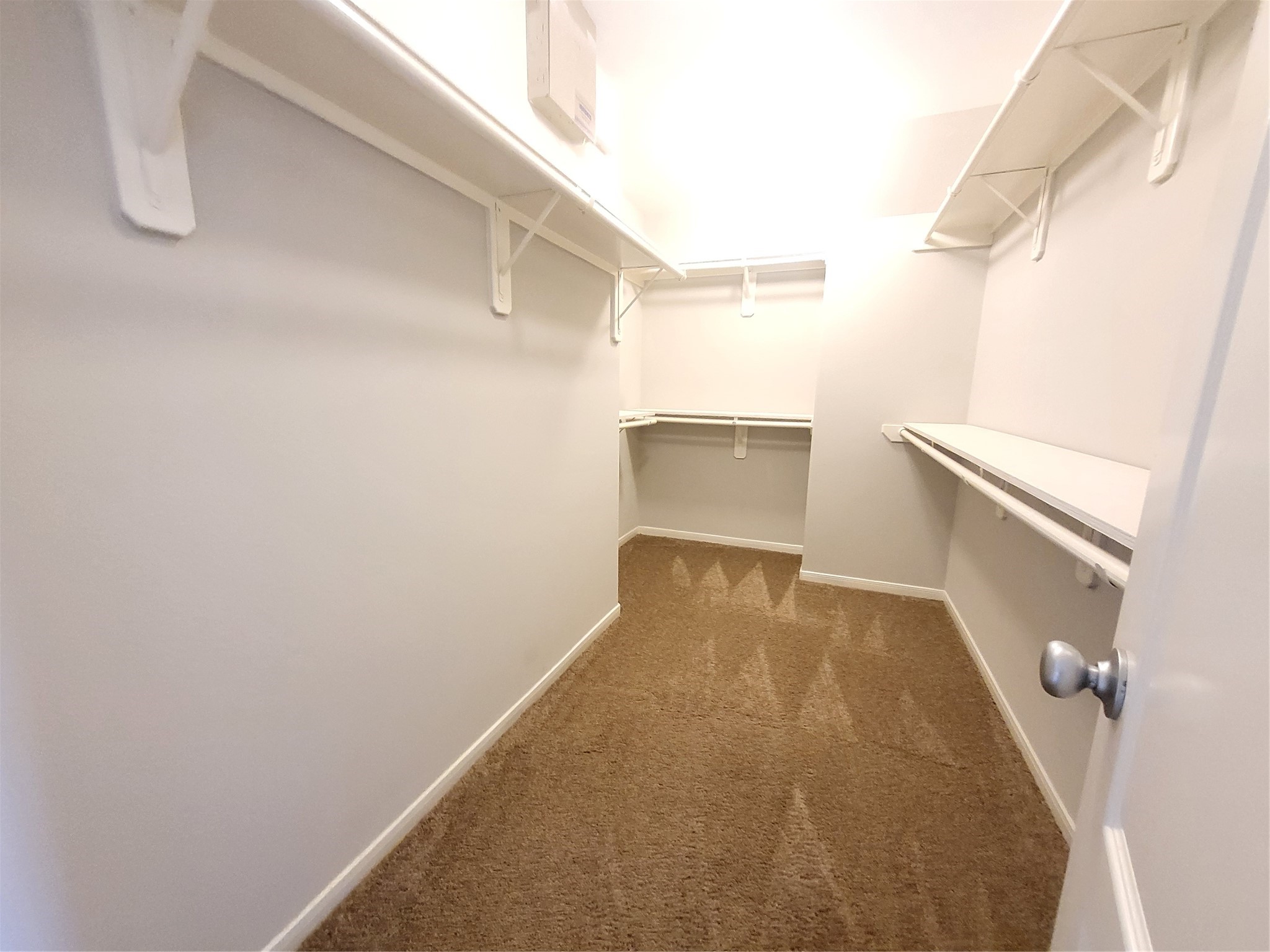 7415 Hollister Ridge Houston, TX 77040 - Photo 22 of 36 a view of a room with racks on the wall